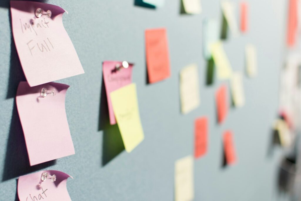 Colourful sticky notes pinned to a planning board